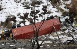 Semi-truck at bottom of embankment in Oregon