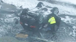 car rollover on Zakim bridge in boston
